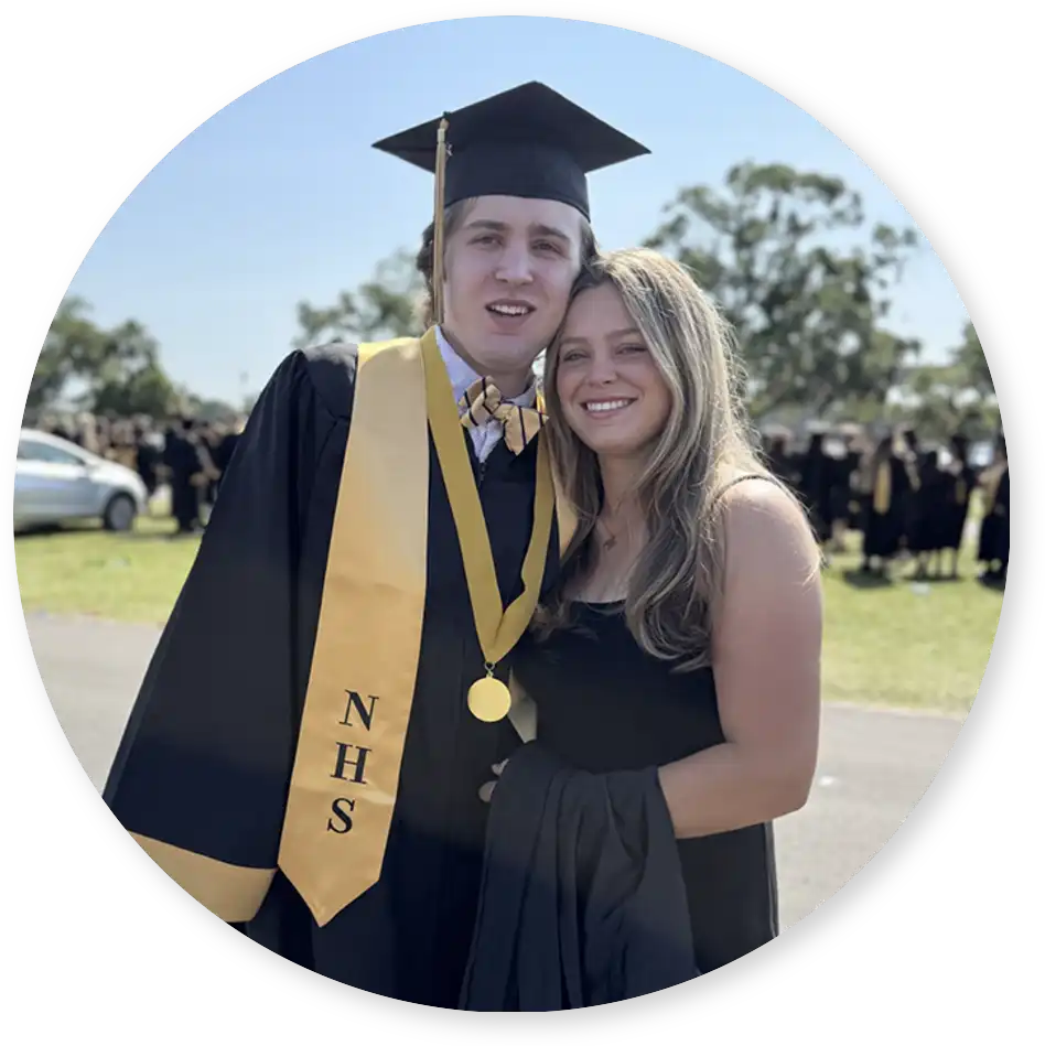 Cole in his graduation cap and gown with Samantha