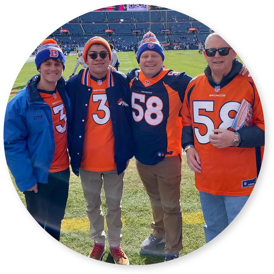 Evren Ayik and family at a Denver Broncos game