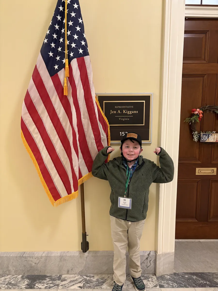 Young advocate flexing outside Representative Jen A. Kiggans' office on Capitol Hill
